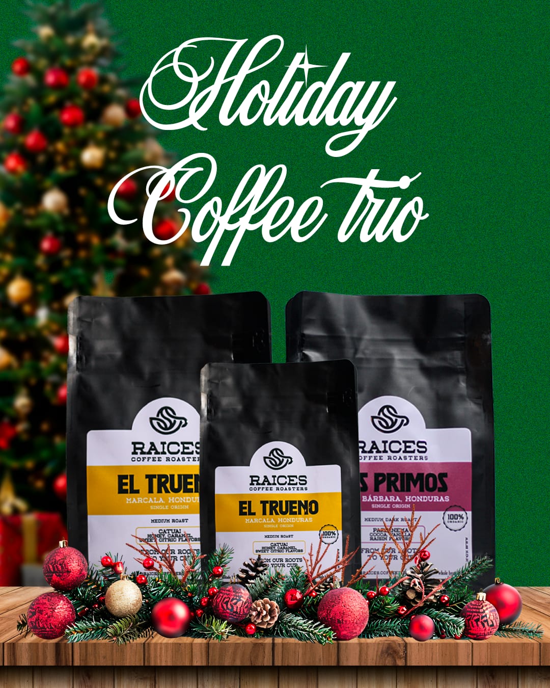 Raíces Coffee Roasters Holiday Coffee Trio with two 22oz bags and a free 8oz bag displayed with Christmas decorations on a wooden table